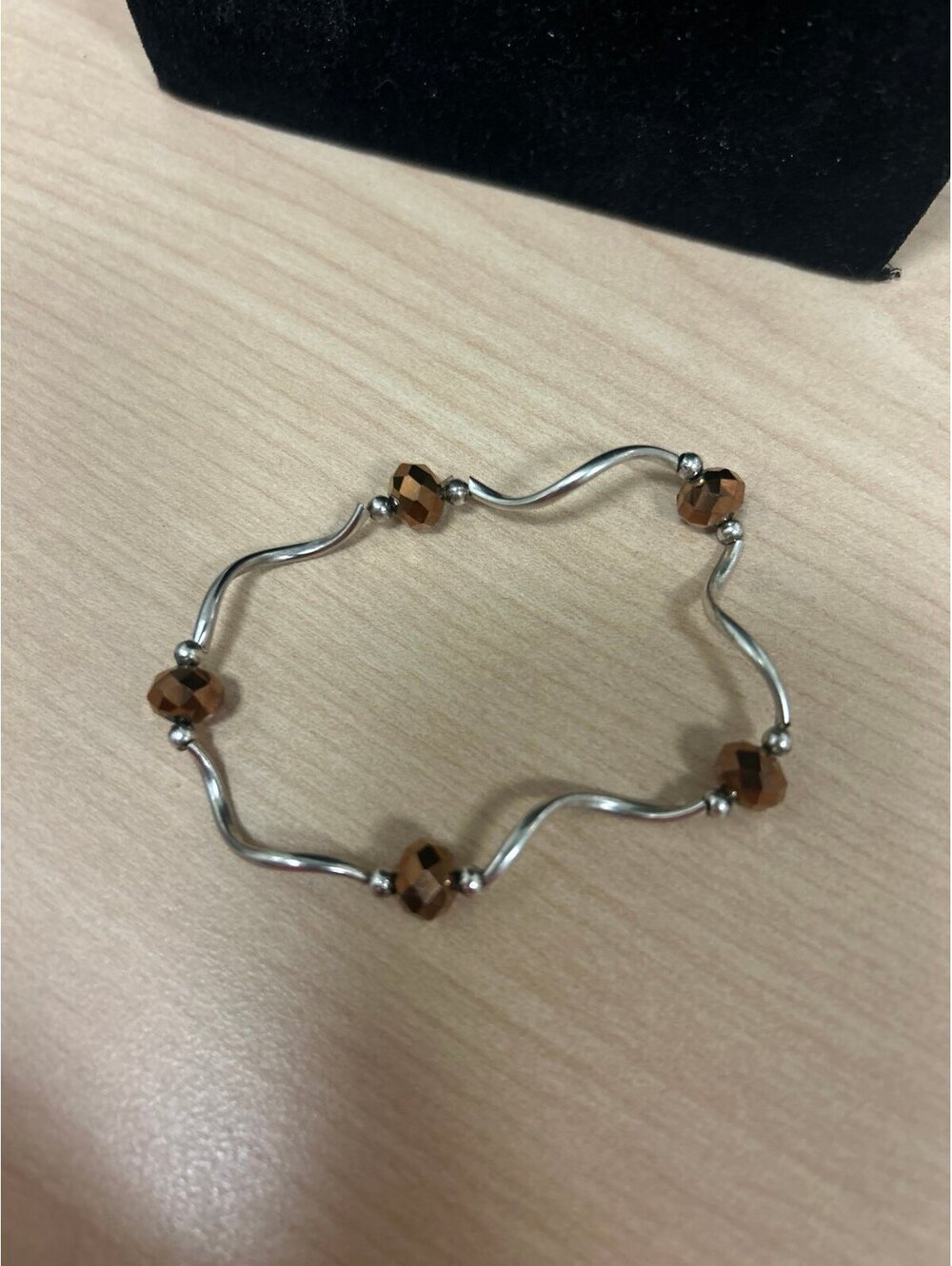 Silver Tone Wavy Stretch Bracelet with Bronze Color Crystal Beads